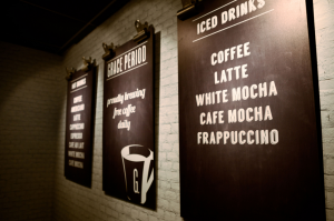Printed menu board mounted on a wall